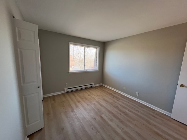 20206 South Frankfort Square Road, Unit K Frankfort, IL 60423 - Photo 23 of 30 an empty room with wooden floor and windows