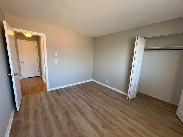 20206 South Frankfort Square Road, Unit K Frankfort, IL 60423 - Photo 25 of 30 an empty room with wooden floor and a sink