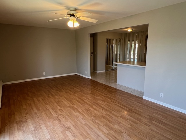 20206 South Frankfort Square Road, Unit K Frankfort, IL 60423 - Photo 8 of 30 a view of an empty room with chandelier fan and wooden floor