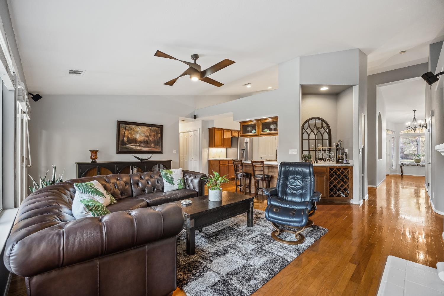 161 Sunset Street Kingsburg, CA 93631 - Photo 19 of 57 a living room with furniture a rug and a chandelier