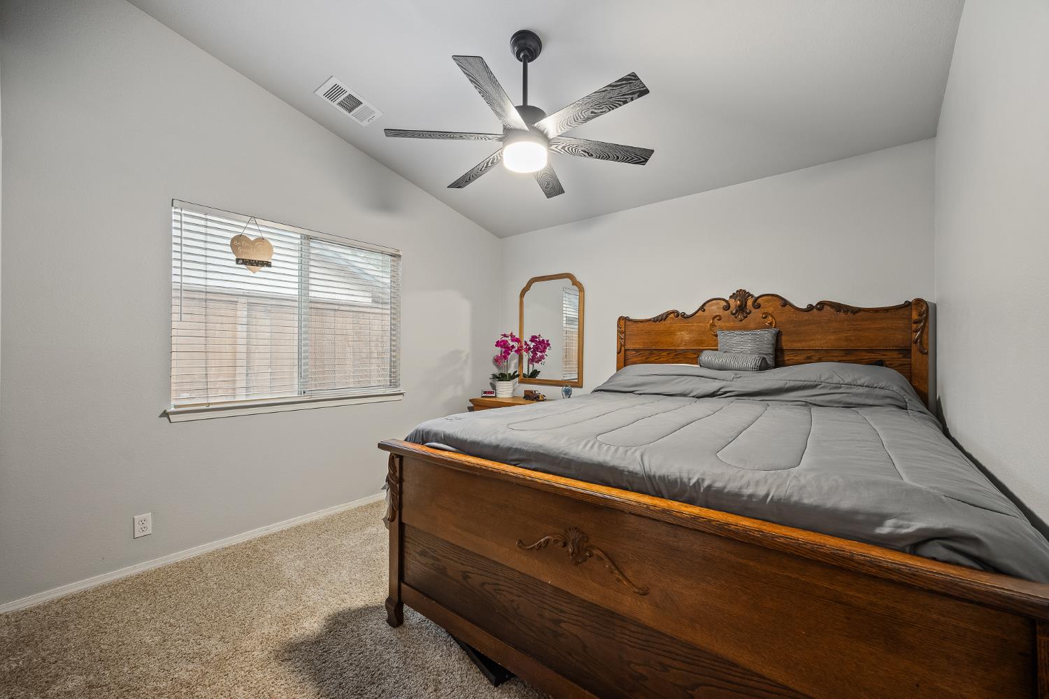 161 Sunset Street Kingsburg, CA 93631 - Photo 32 of 57 a bedroom with a bed and window