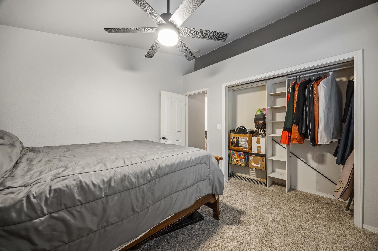 161 Sunset Street Kingsburg, CA 93631 - Photo 33 of 57 a bed room with a bed and a flat tv screen