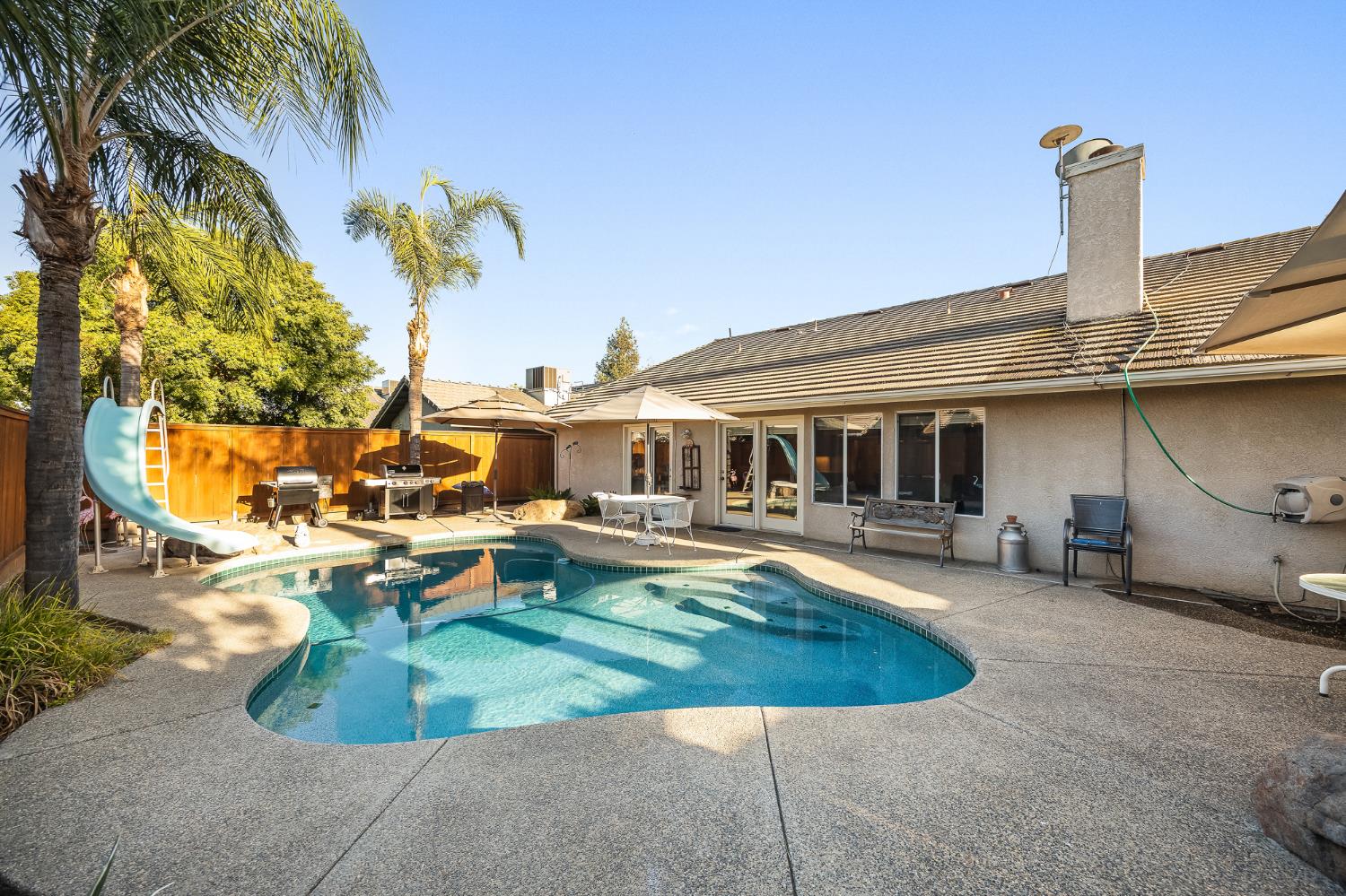 161 Sunset Street Kingsburg, CA 93631 - Photo 43 of 57 a front view of a house with swimming pool having outdoor seating