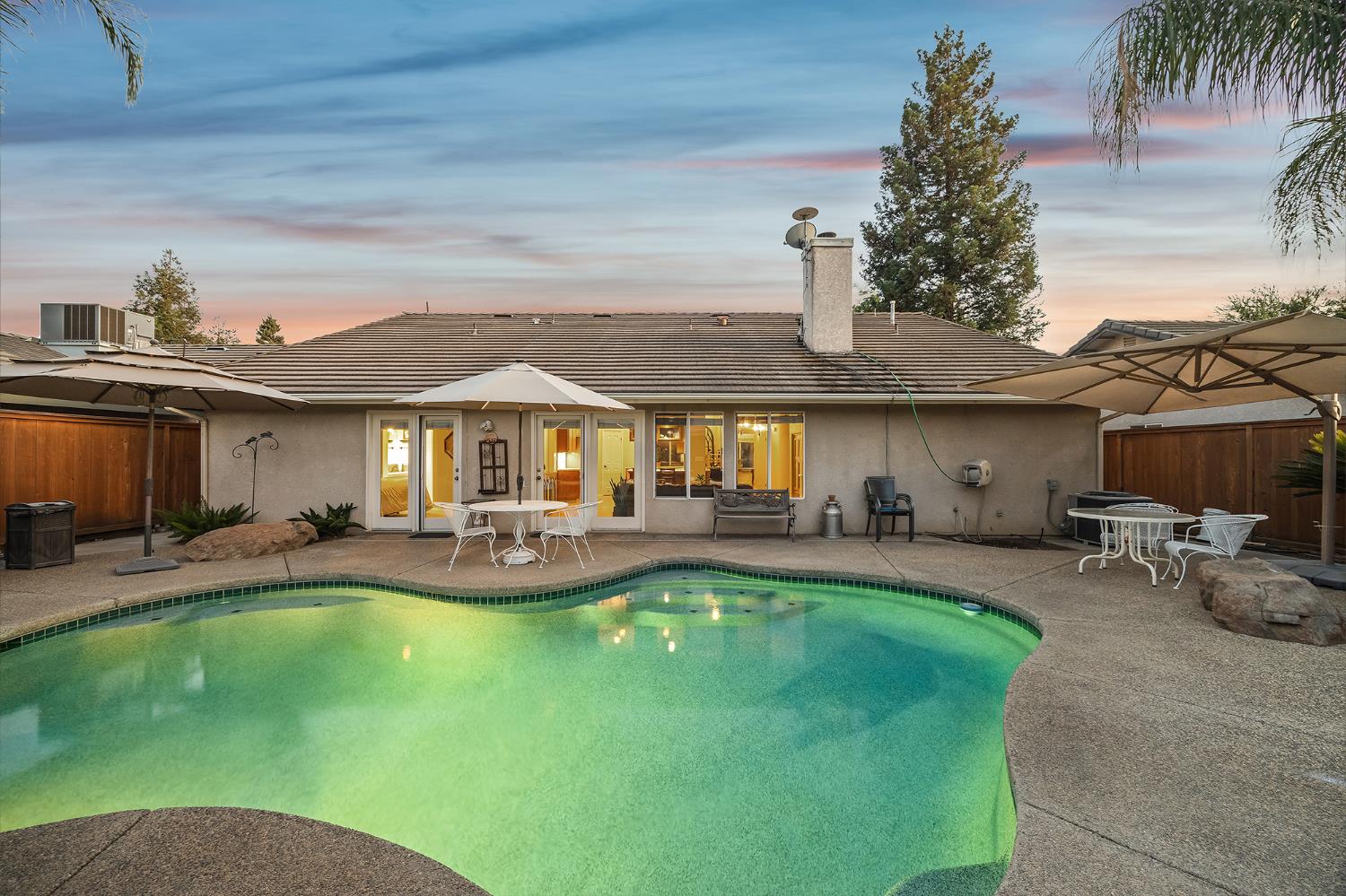 161 Sunset Street Kingsburg, CA 93631 - Photo 47 of 57 a view of a house with swimming pool and sitting area
