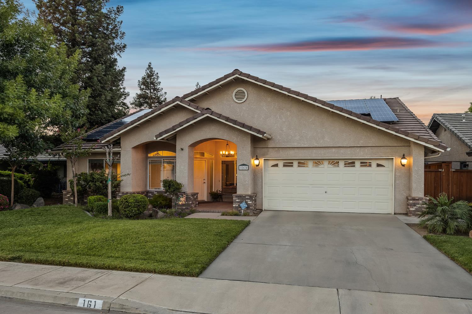 161 Sunset Street Kingsburg, CA 93631 - Photo 53 of 57 a front view of a house with a garden and plants