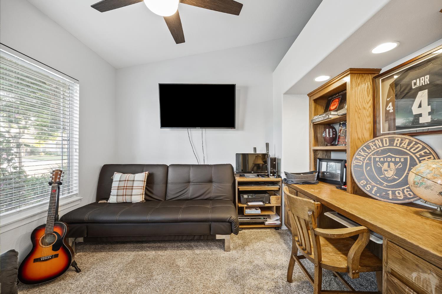 161 Sunset Street Kingsburg, CA 93631 - Photo 6 of 57 a living room with furniture a flat screen tv and a window
