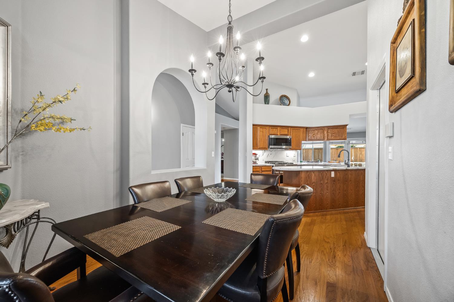 161 Sunset Street Kingsburg, CA 93631 - Photo 10 of 57 a view of a dining room with furniture and a chandelier