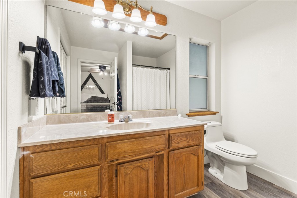 14366 Carnegie Road Magalia, CA 95954 - Photo 12 of 28 a bathroom with a sink a toilet and mirror