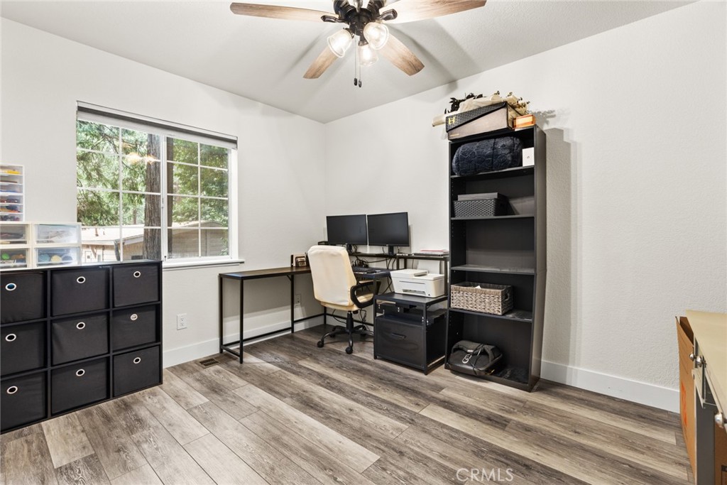 14366 Carnegie Road Magalia, CA 95954 - Photo 14 of 28 a view of a workspace with furniture and a window