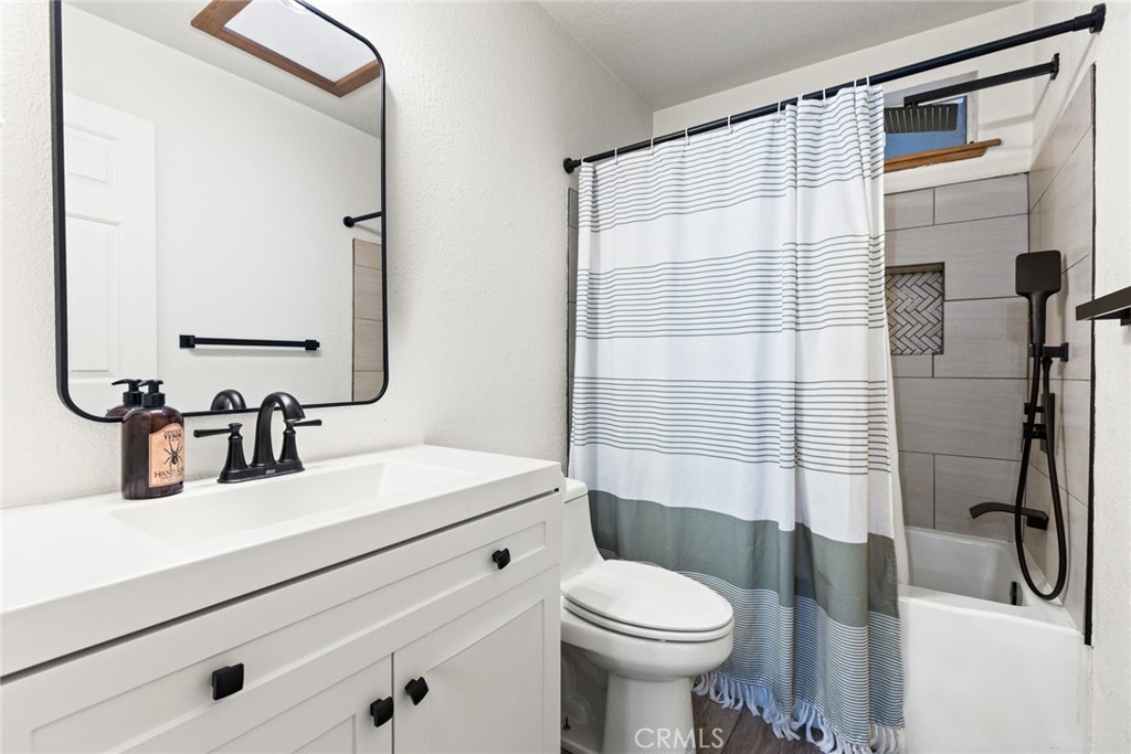 14366 Carnegie Road Magalia, CA 95954 - Photo 15 of 28 a bathroom with a sink a toilet and shower