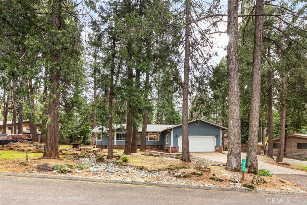 14366 Carnegie Road Magalia, CA 95954 - Photo 17 of 28 a view of a house with a yard covered in snow