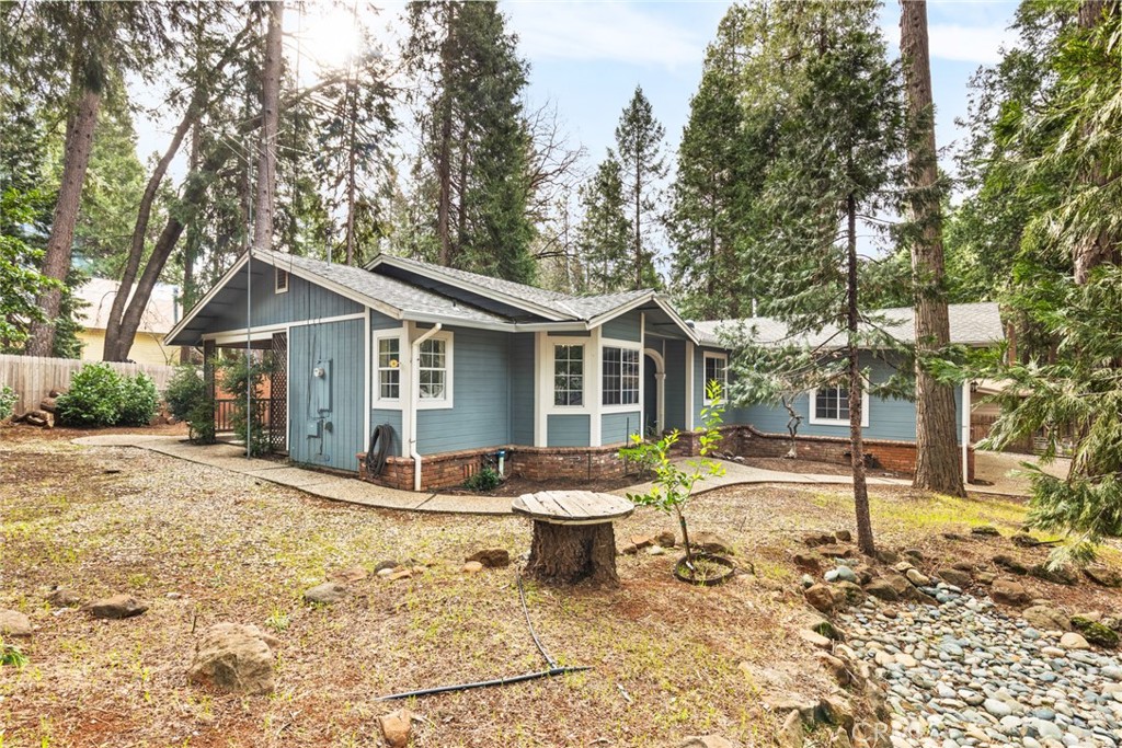 14366 Carnegie Road Magalia, CA 95954 - Photo 18 of 28 a view of a house with backyard and trees