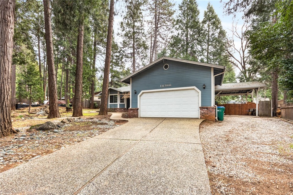 14366 Carnegie Road Magalia, CA 95954 - Photo 19 of 28 a house with trees in the background