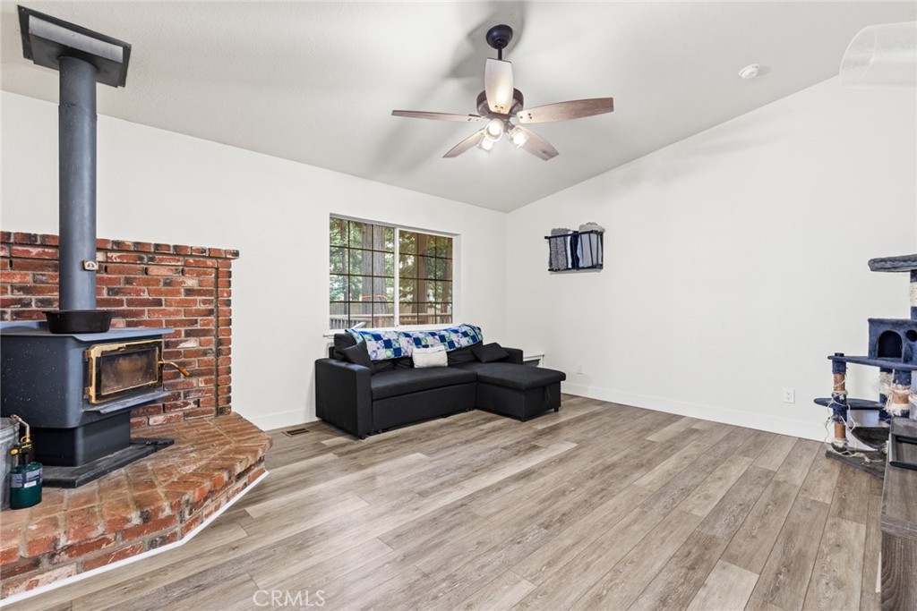 14366 Carnegie Road Magalia, CA 95954 - Photo 2 of 28 a living room with furniture and a flat screen tv