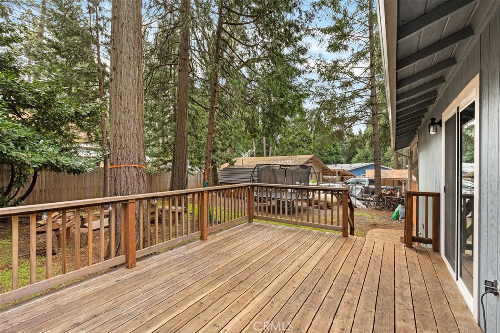 14366 Carnegie Road Magalia, CA 95954 - Photo 24 of 28 a view of a wooden deck with a patio