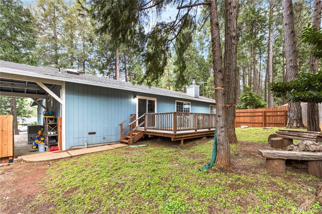 14366 Carnegie Road Magalia, CA 95954 - Photo 25 of 28 a backyard of a house with barbeque oven fire pit and outdoor seating