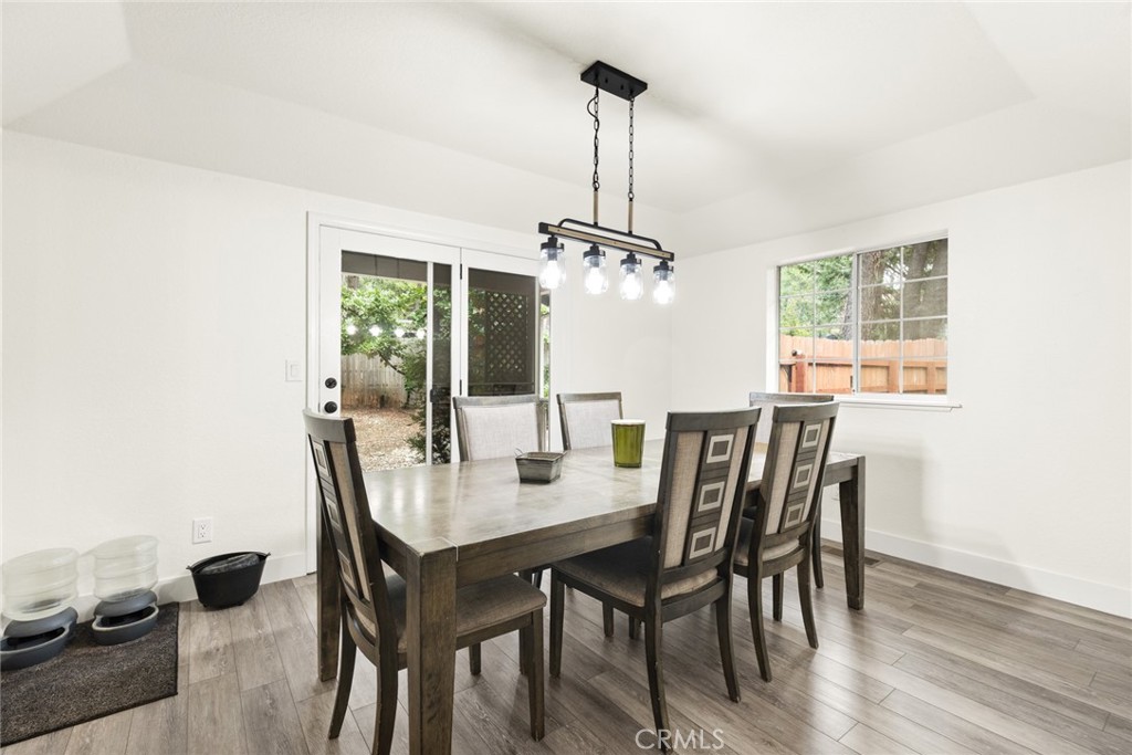 14366 Carnegie Road Magalia, CA 95954 - Photo 6 of 28 a view of a dining room with furniture window and wooden floor