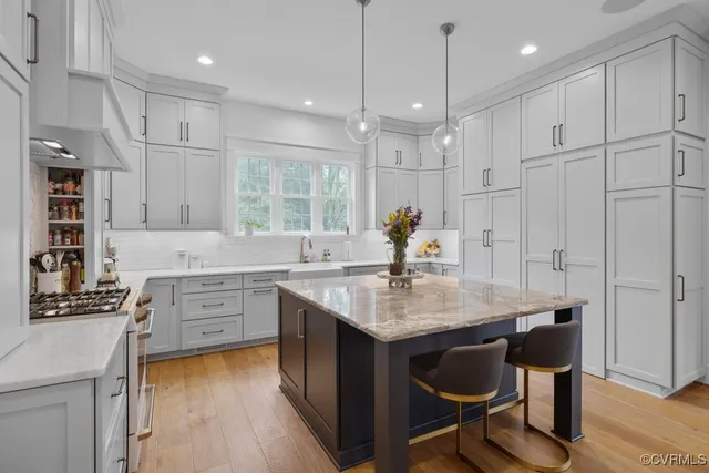 a kitchen with a sink cabinets and window
