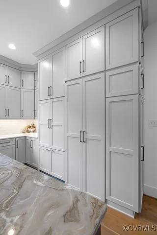 a room with a bed and a cabinets