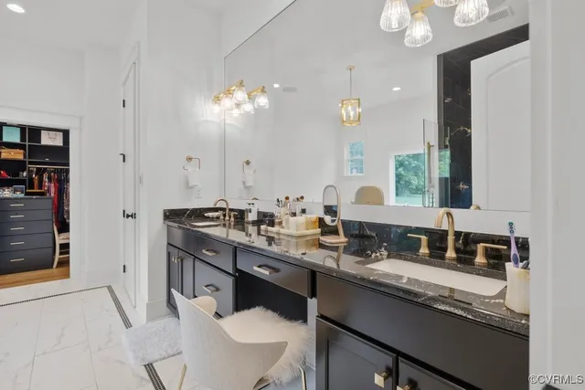 a bathroom with a sink vanity and a mirror