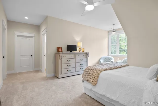 a bathroom with a granite countertop toilet sink and mirror