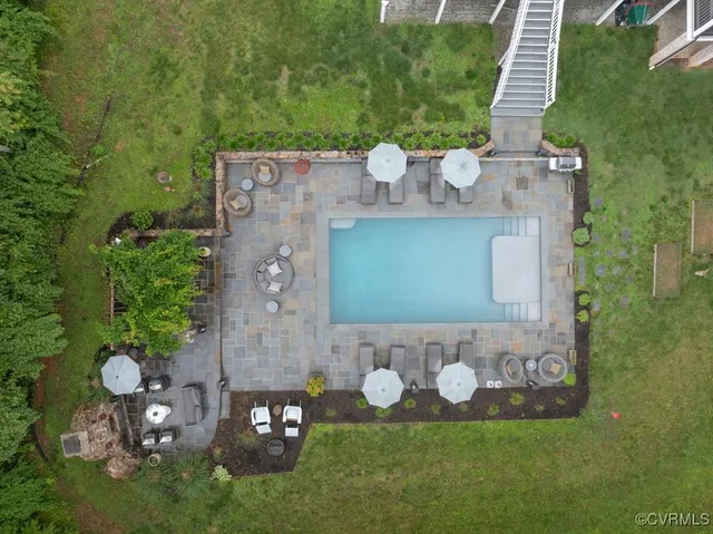 an aerial view of a house with a garden