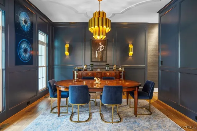 a blue bed sitting in a bedroom next to a lamp