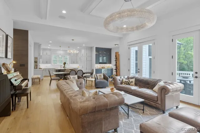 a living room with furniture a fireplace and a window