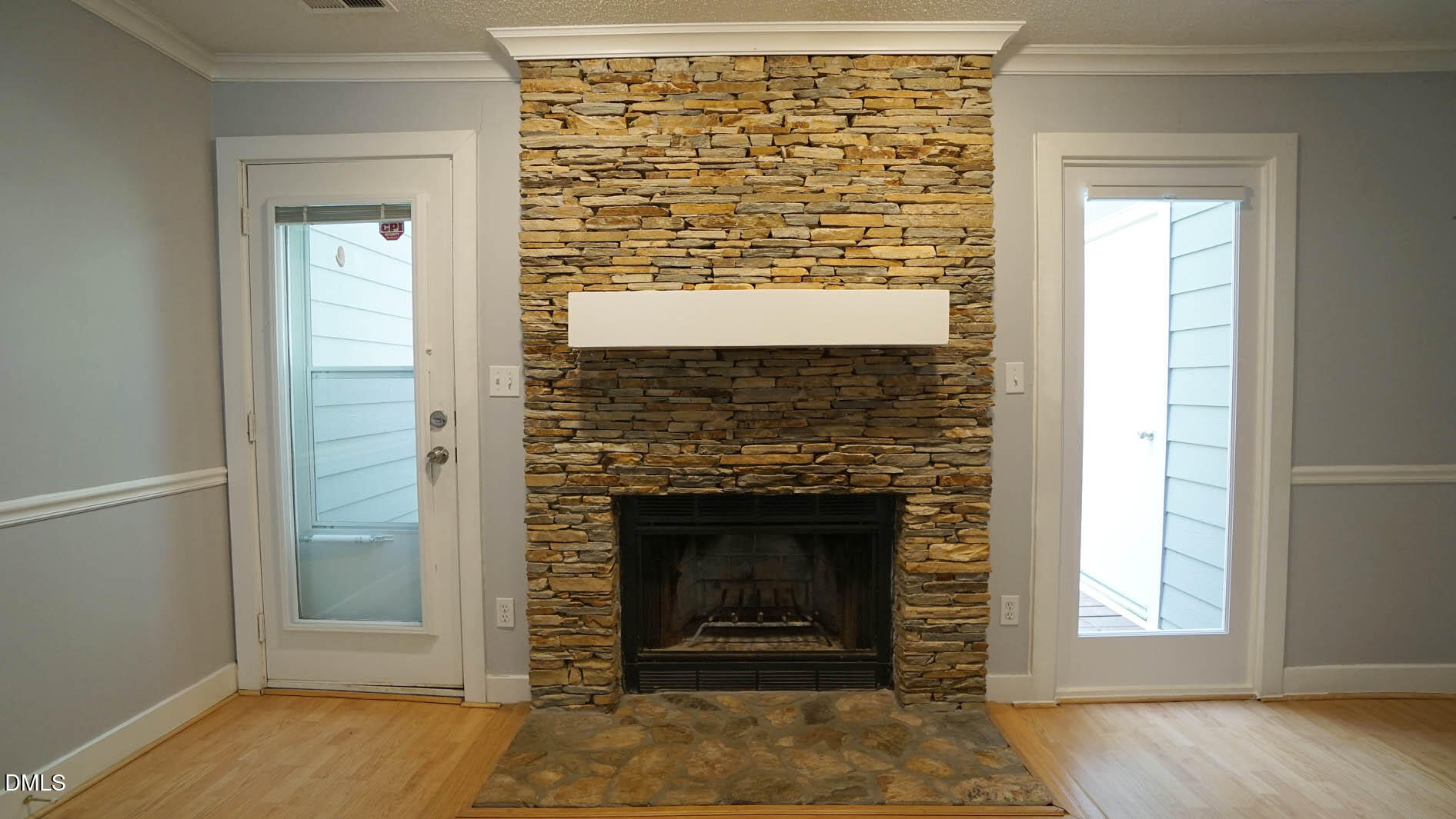 1427 Quarter Point Raleigh, NC 27615 - Photo 13 of 38 an empty room with fireplace and windows
