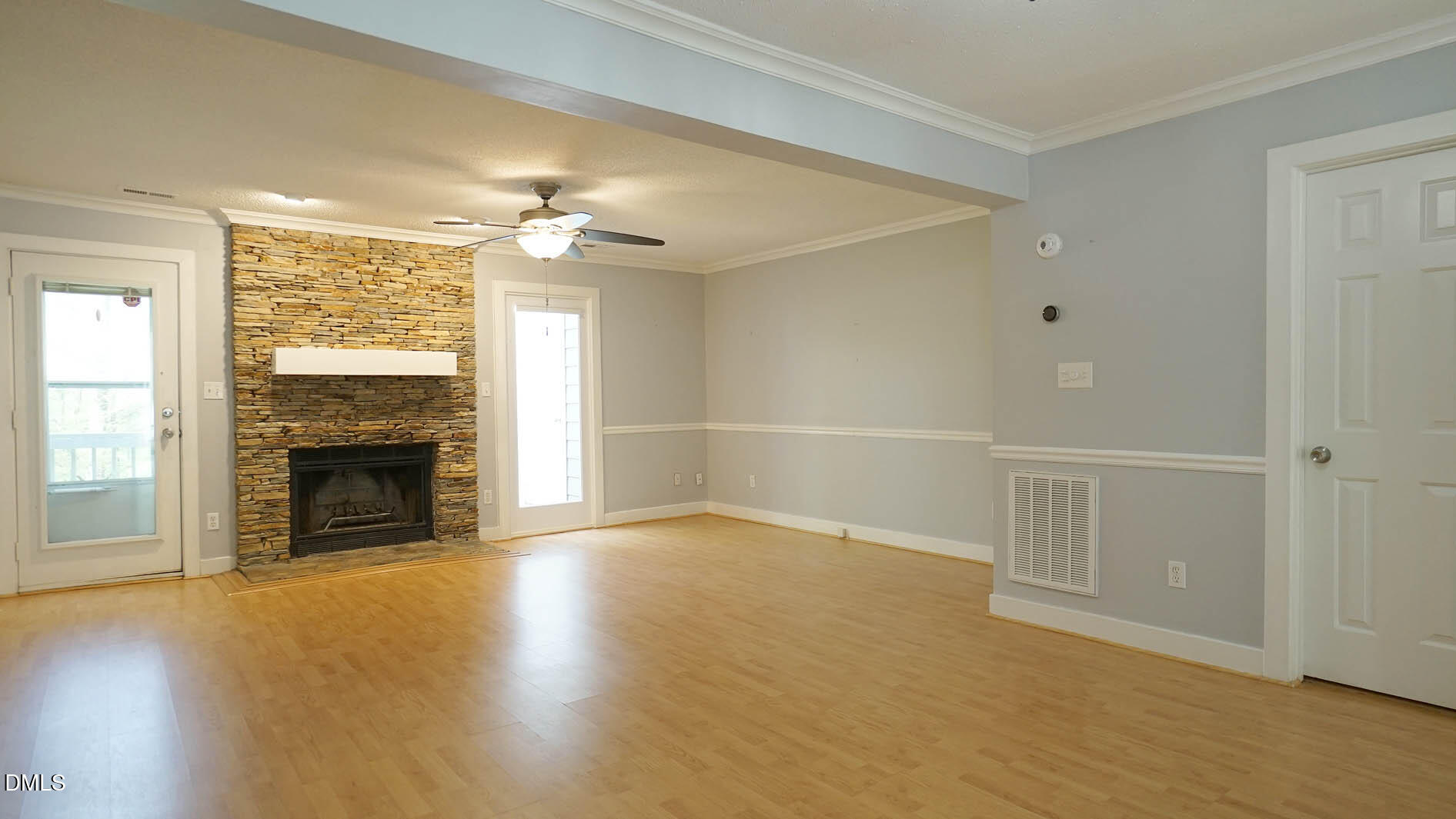 1427 Quarter Point Raleigh, NC 27615 - Photo 14 of 38 an empty room with windows fireplace and a sink