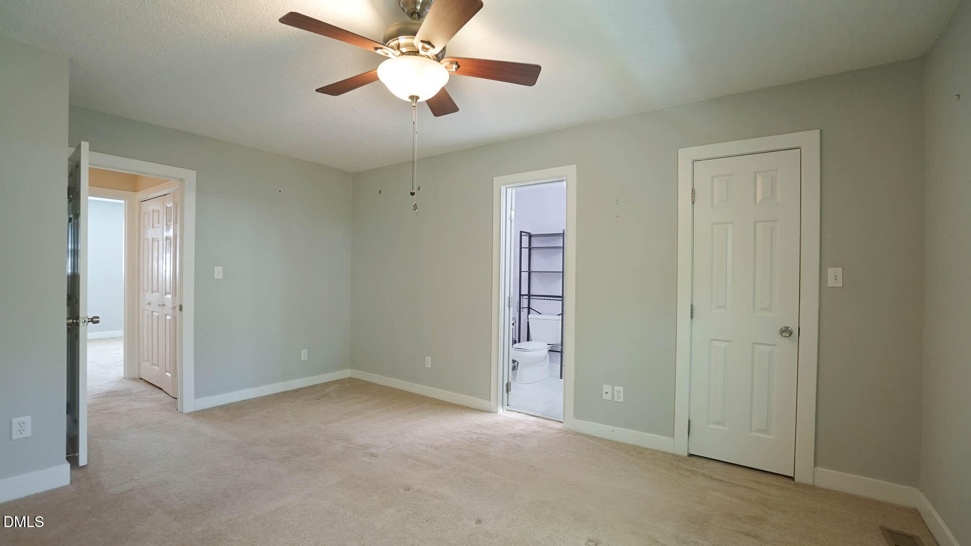 1427 Quarter Point Raleigh, NC 27615 - Photo 18 of 38 an empty room with closet and a chandelier fan