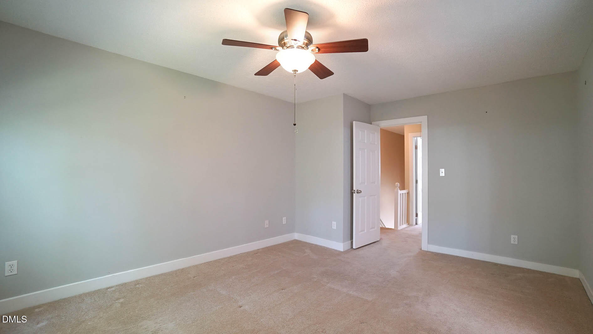 1427 Quarter Point Raleigh, NC 27615 - Photo 20 of 38 an empty room with closet and a chandelier fan