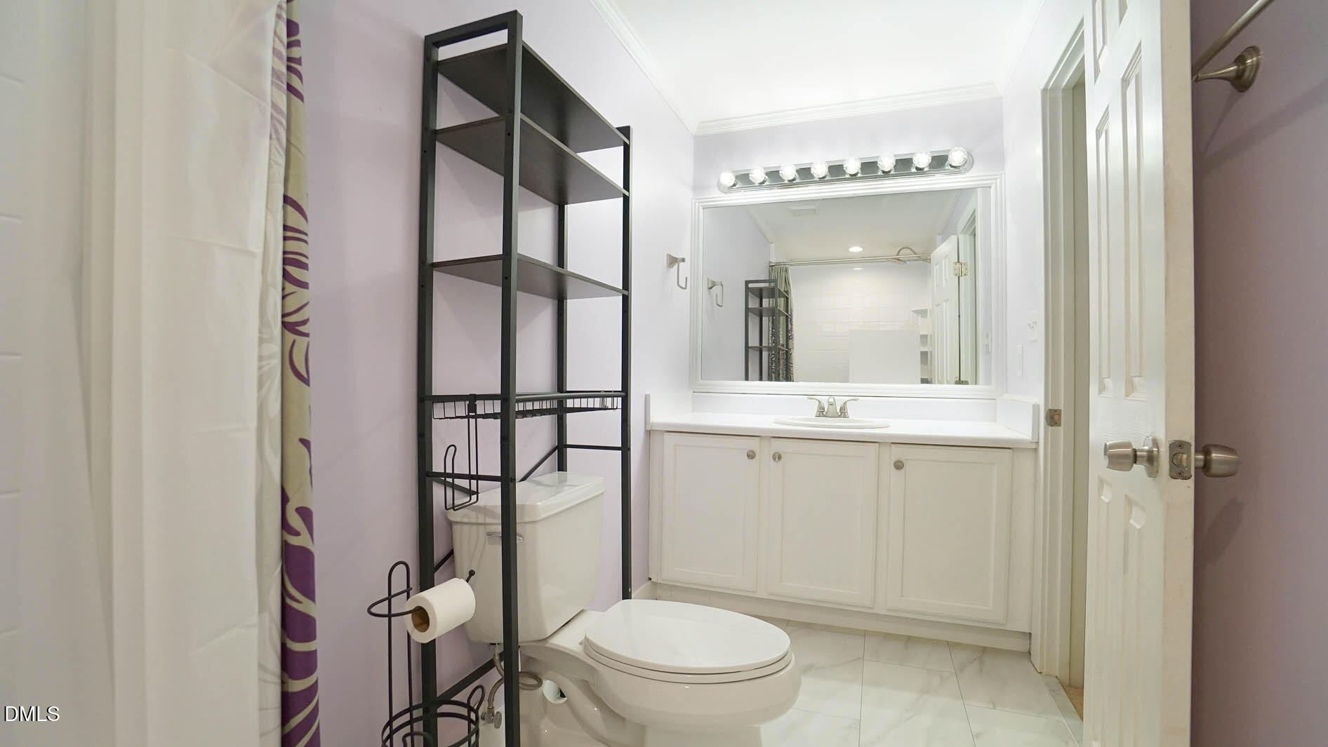 1427 Quarter Point Raleigh, NC 27615 - Photo 21 of 38 a bathroom with a toilet a sink and a mirror
