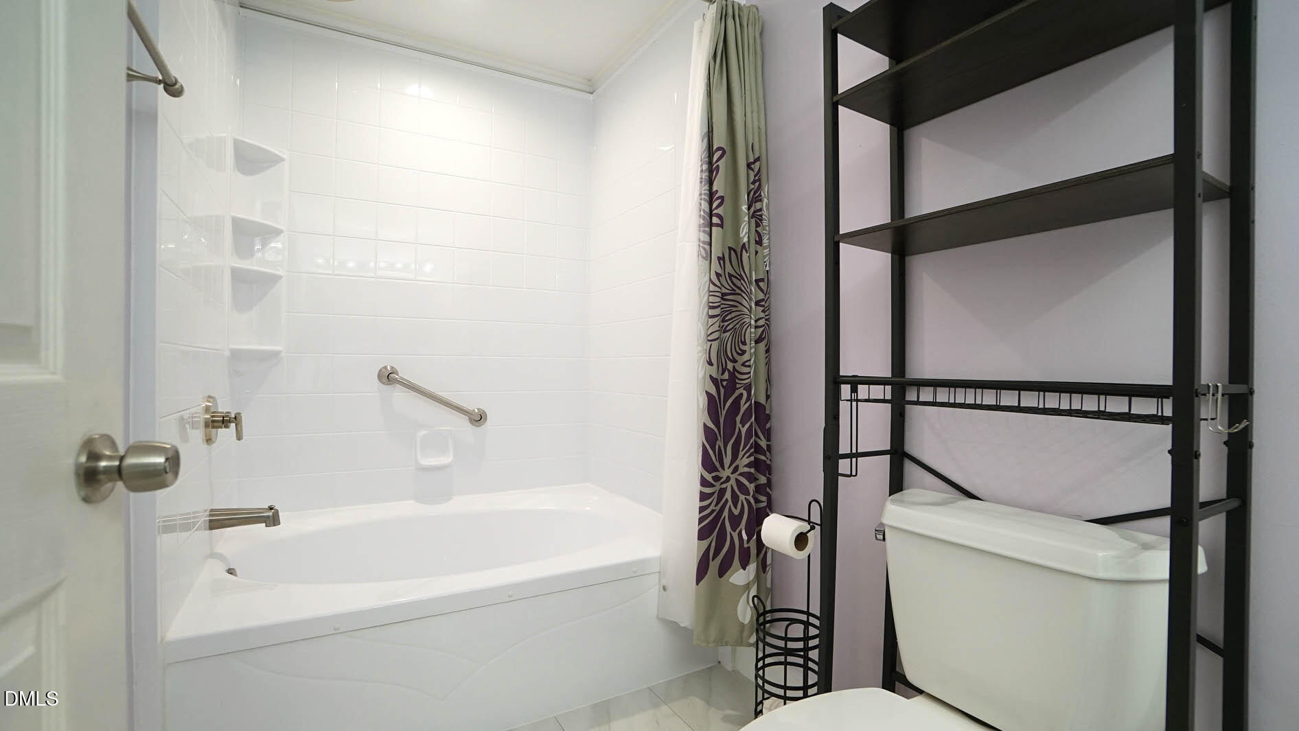 1427 Quarter Point Raleigh, NC 27615 - Photo 23 of 38 a bathroom with a bathtub a toilet and a shower