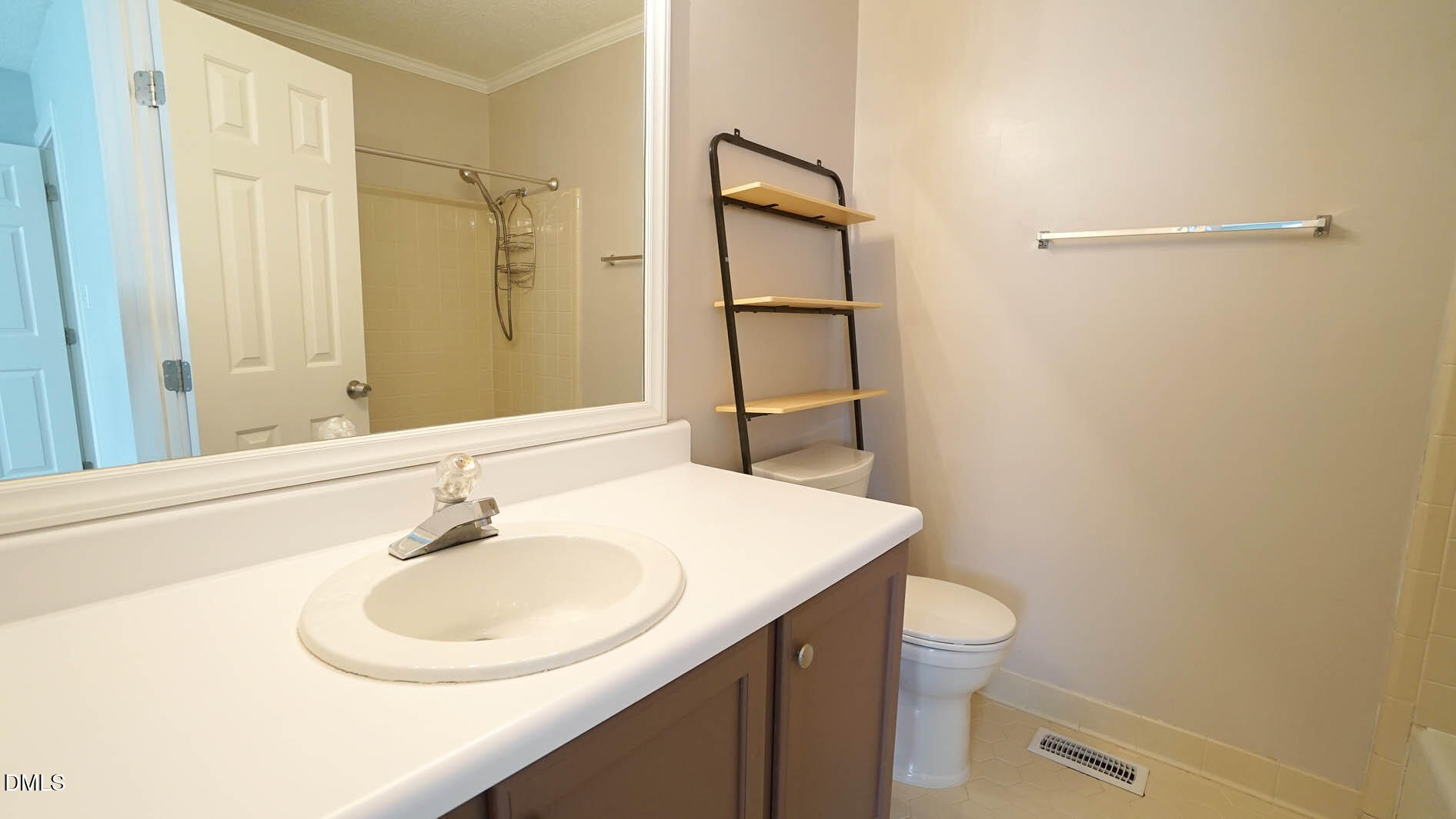 1427 Quarter Point Raleigh, NC 27615 - Photo 28 of 38 a bathroom with a sink a toilet and shower