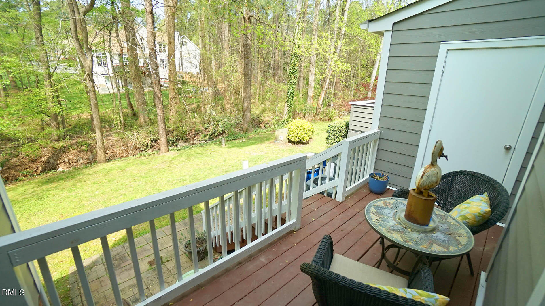 1427 Quarter Point Raleigh, NC 27615 - Photo 35 of 38 a view of a balcony with dining table and chairs