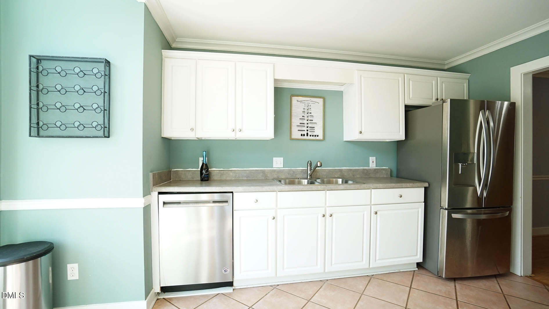 1427 Quarter Point Raleigh, NC 27615 - Photo 6 of 38 a kitchen with a sink cabinets and stainless steel appliances