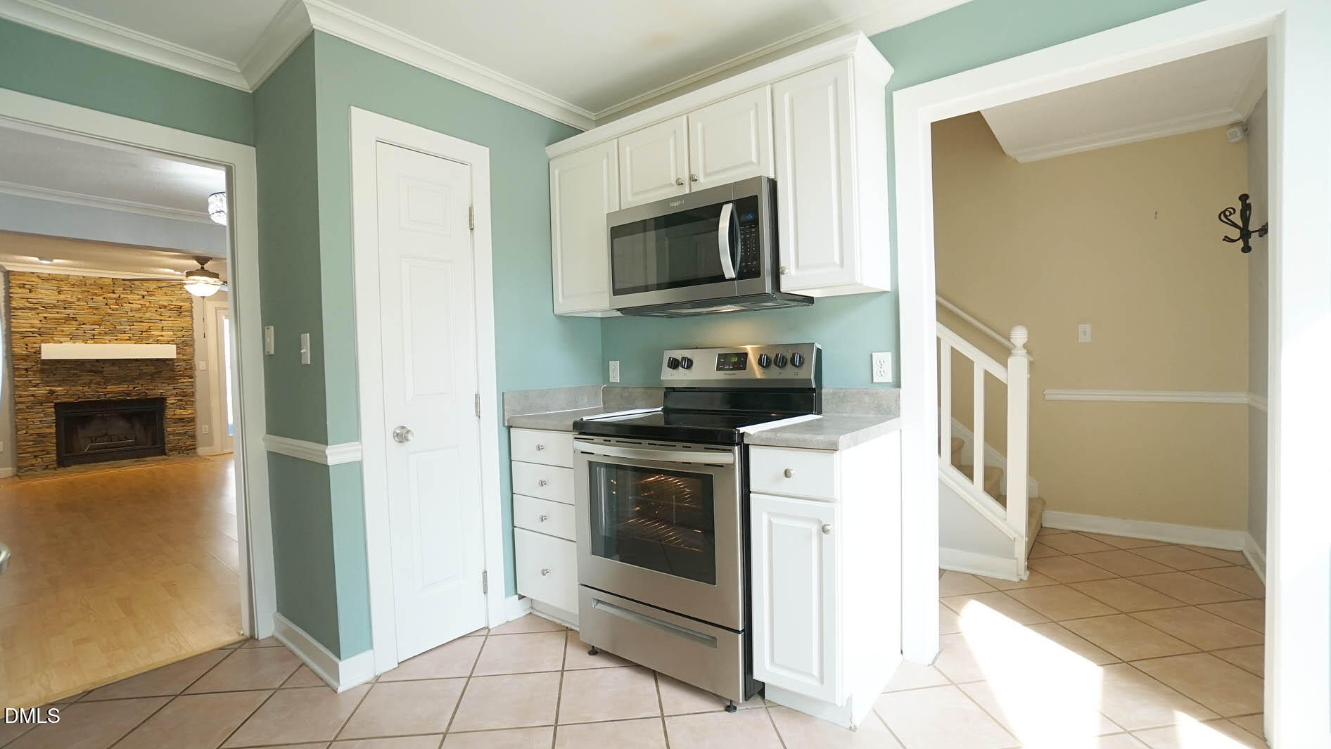 1427 Quarter Point Raleigh, NC 27615 - Photo 7 of 38 a kitchen with stainless steel appliances granite countertop a stove a microwave and a refrigerator