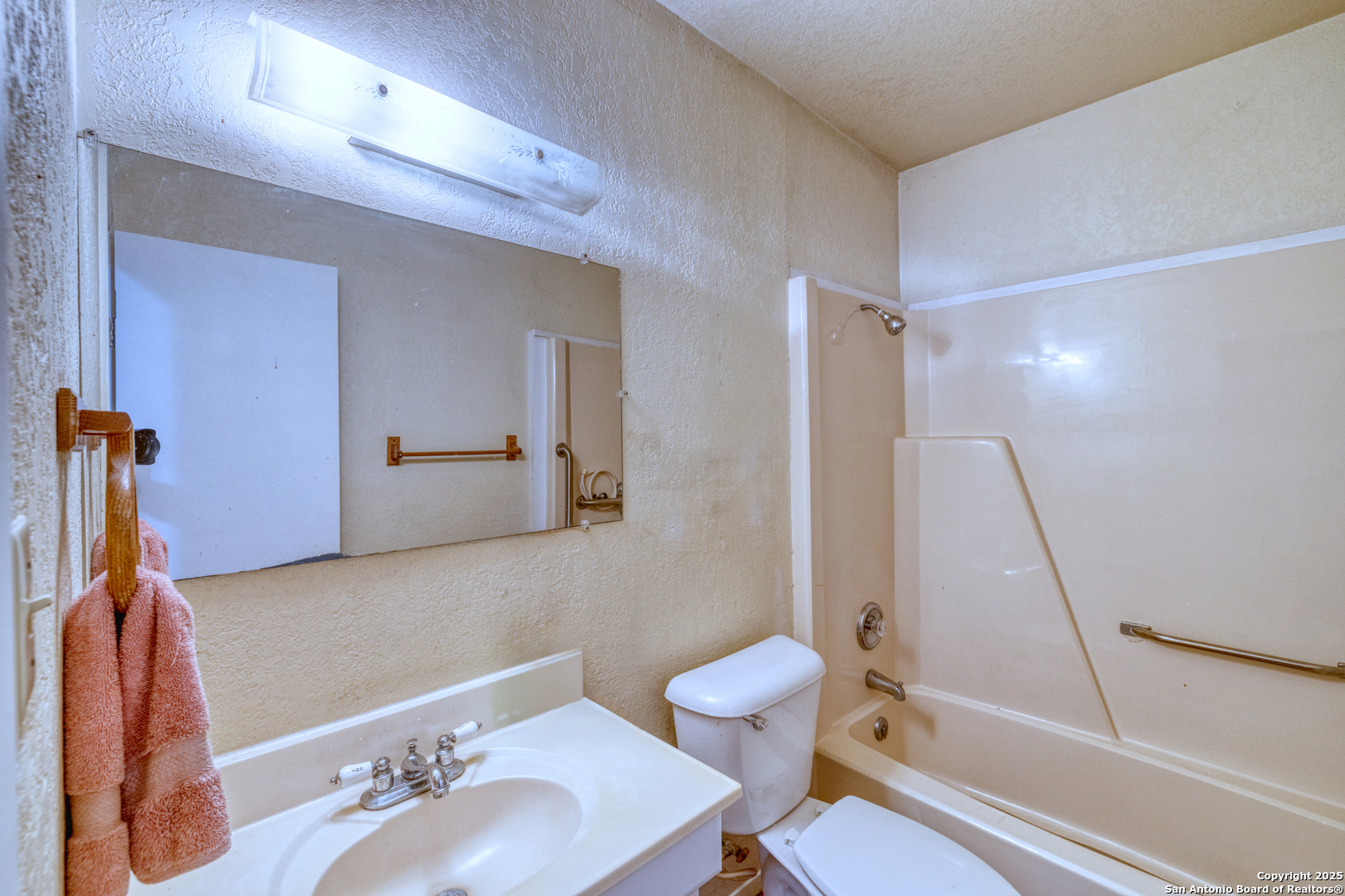 1390 Windmill Road Uvalde, TX 78801 - Photo 13 of 44 a bathroom with a sink toilet and shower
