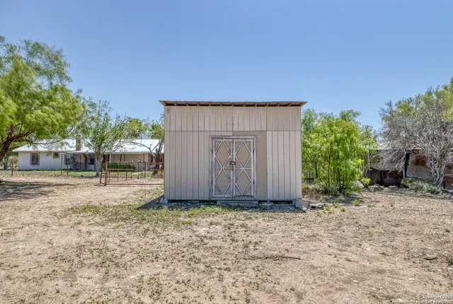 a view of outdoor space with deck and tree