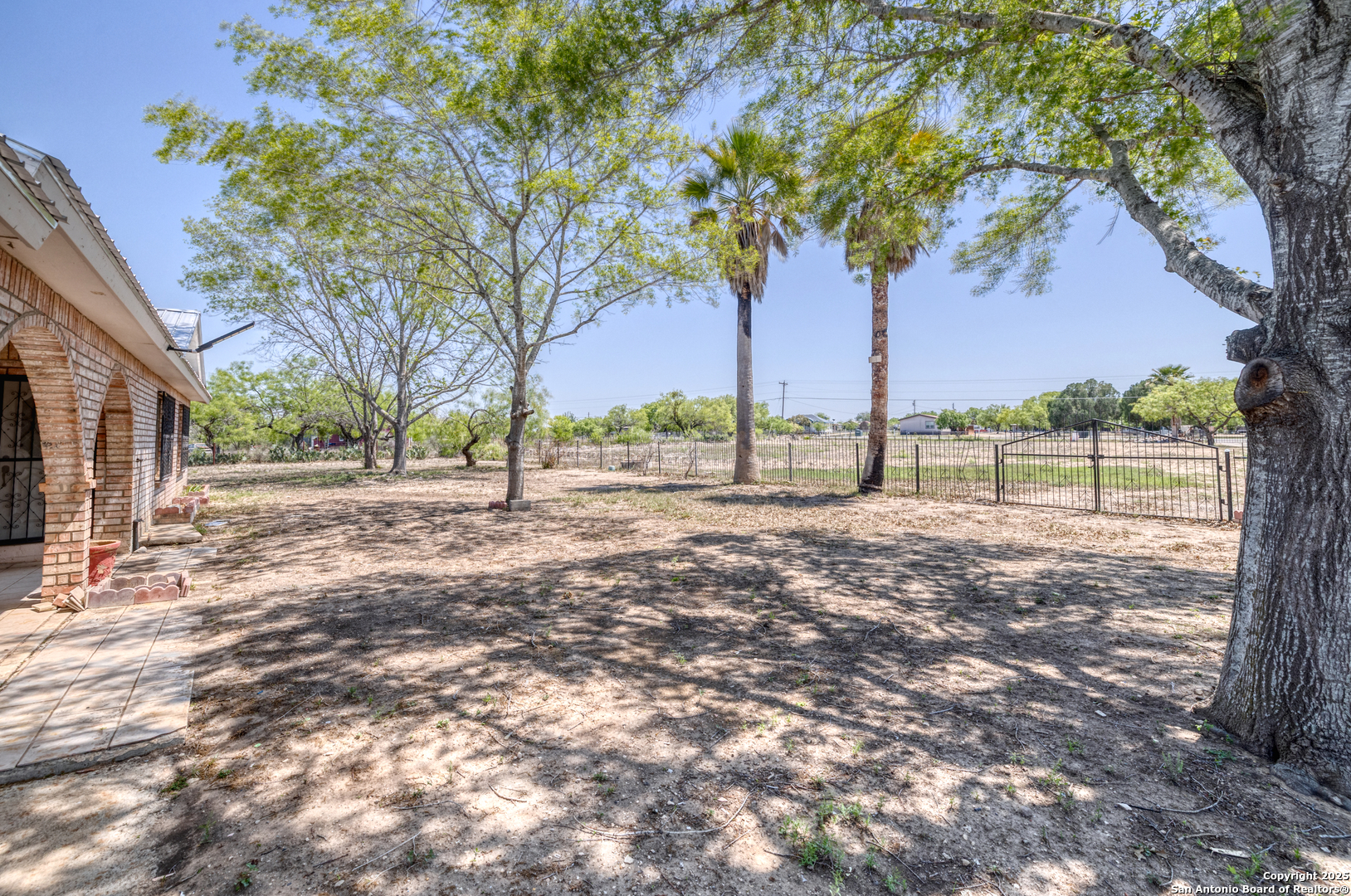 1390 Windmill Road Uvalde, TX 78801 - Photo 30 of 44 a view of outdoor space with deck and tree
