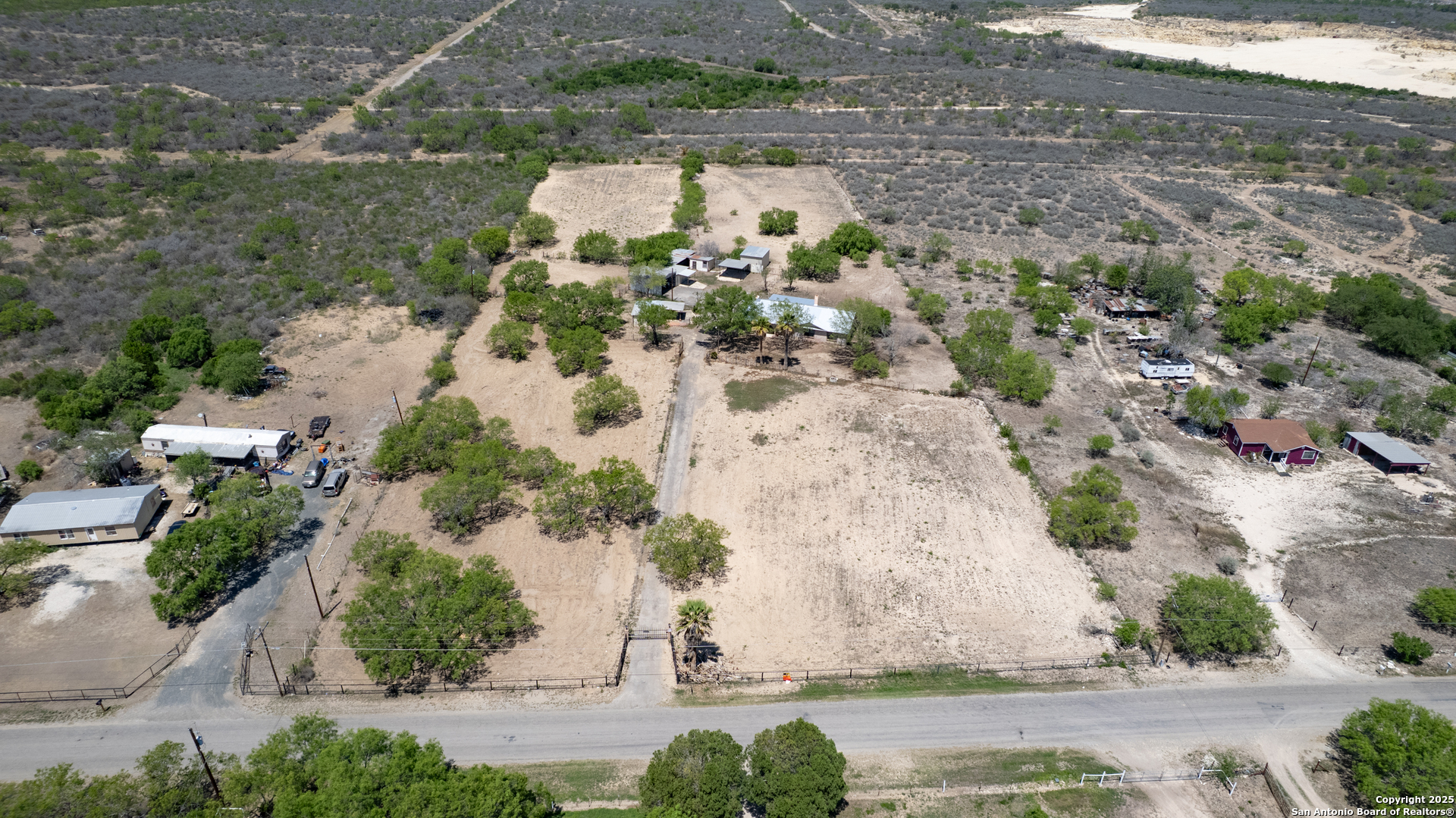 1390 Windmill Road Uvalde, TX 78801 - Photo 33 of 44 an aerial view of a house with a yard