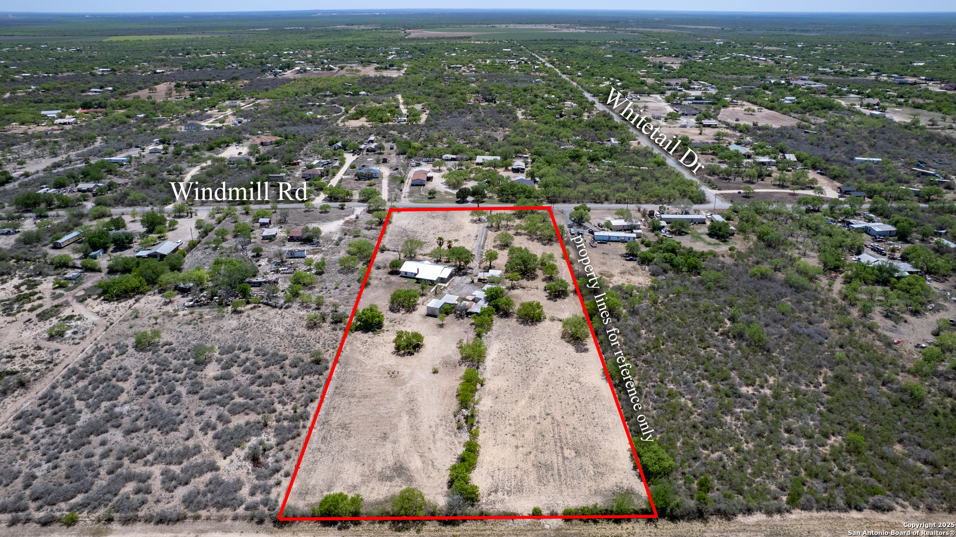 1390 Windmill Road Uvalde, TX 78801 - Photo 36 of 44 an aerial view of residential houses with outdoor space
