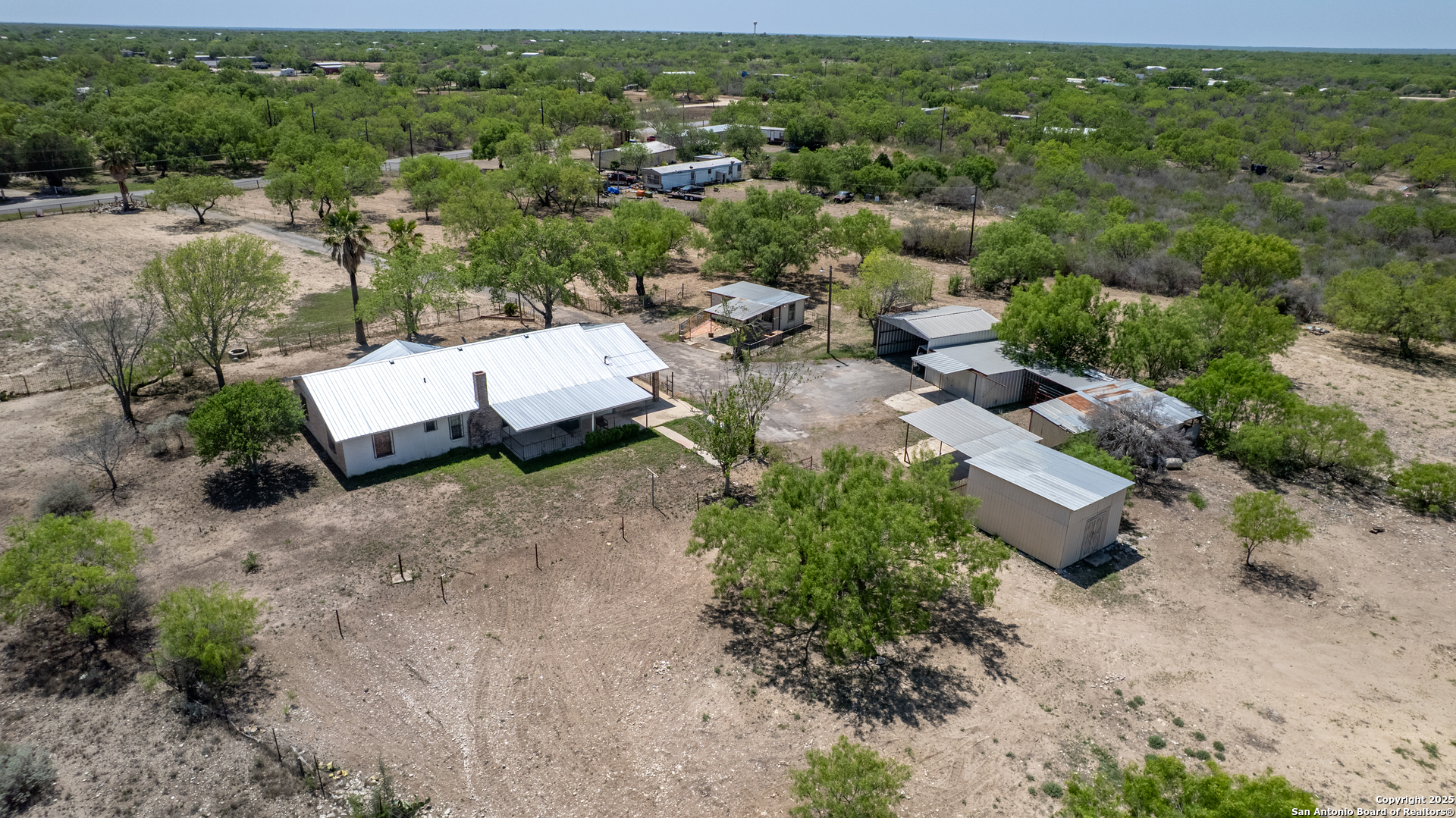 1390 Windmill Road Uvalde, TX 78801 - Photo 38 of 44 an aerial view of a house with a yard