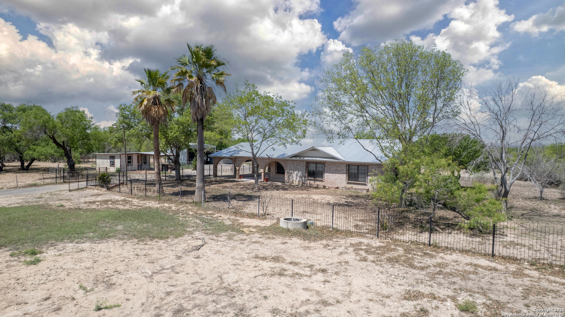 1390 Windmill Road Uvalde, TX 78801 - Photo 40 of 44 a view of a house with a yard