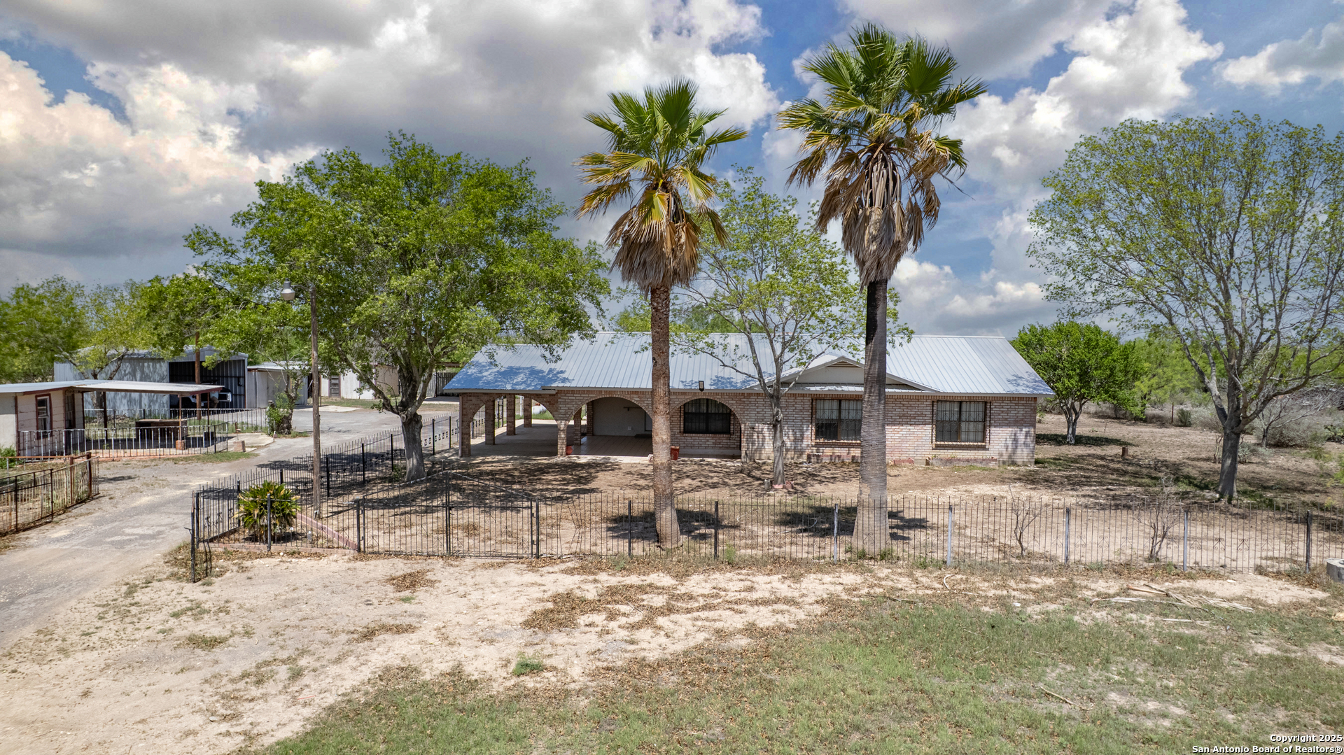 1390 Windmill Road Uvalde, TX 78801 - Photo 41 of 44 a front view of a house with garden
