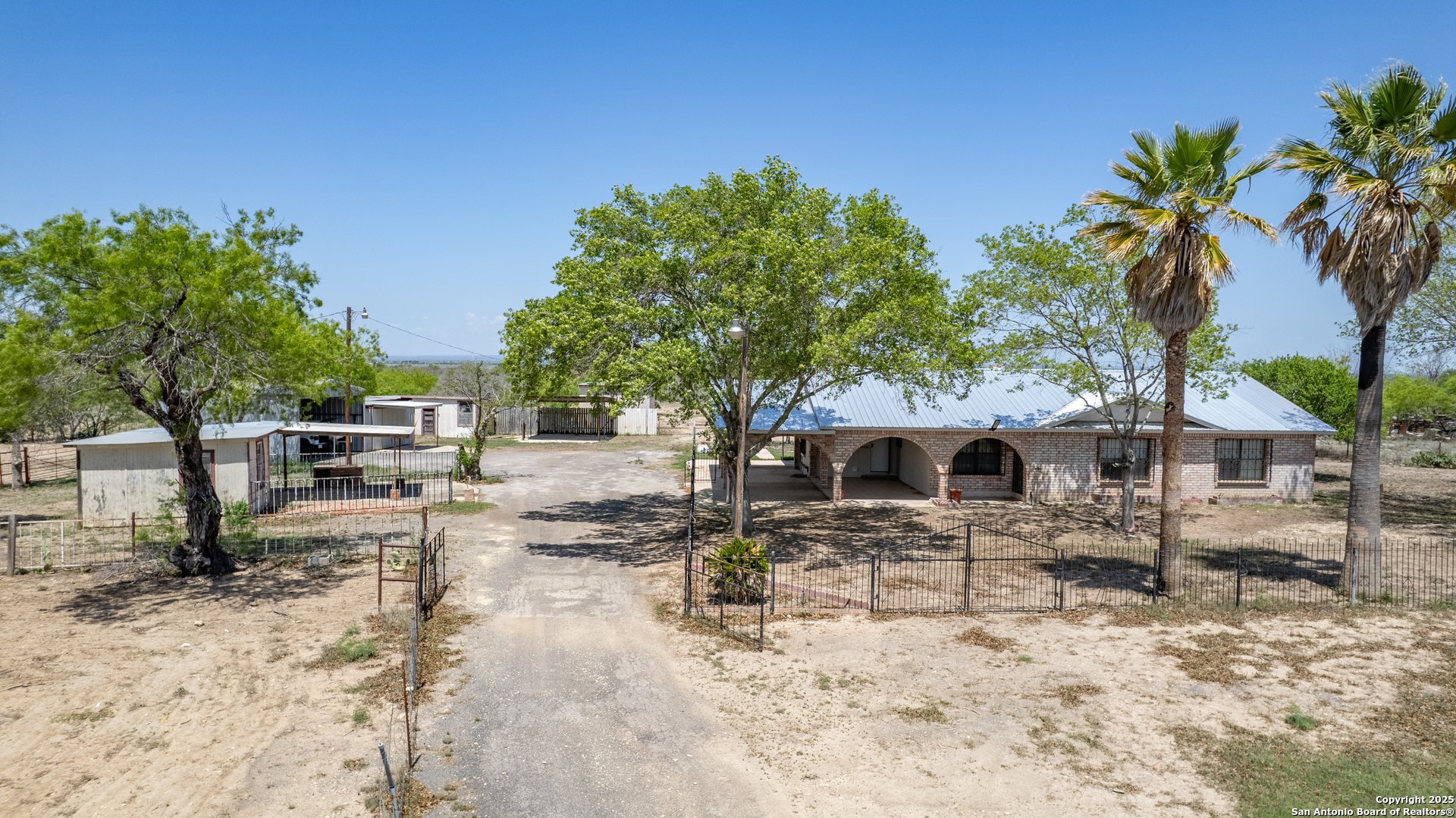 1390 Windmill Road Uvalde, TX 78801 - Photo 42 of 44 a view of a terrace with chairs and potted plants