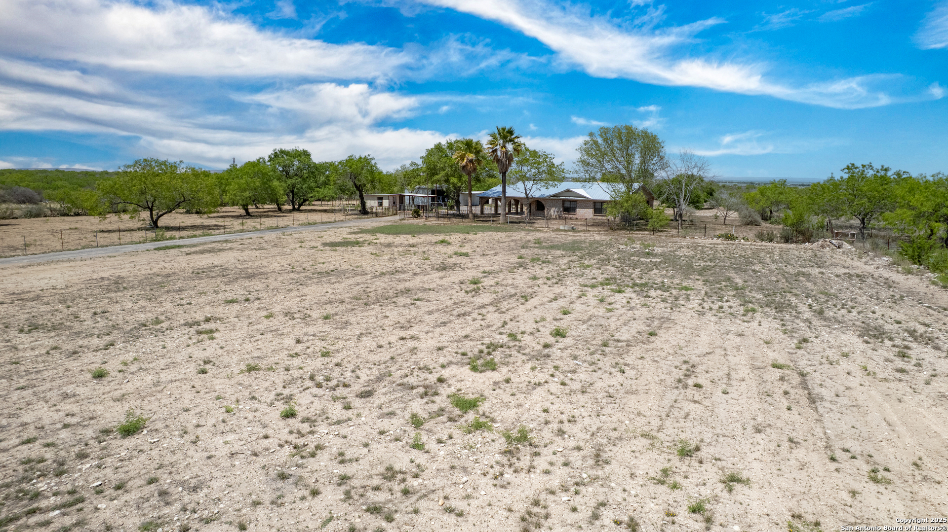 1390 Windmill Road Uvalde, TX 78801 - Photo 44 of 44 a view of large trees with a yard