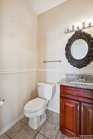a view of a livingroom with stairs and a fireplace
