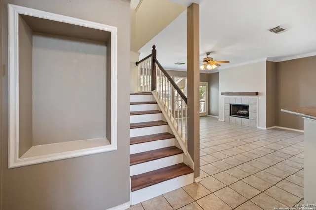 a view of staircase with white walls and a window
